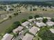 Aerial view of community with lake and golf course at 2620 Locksley St # 261, Sun City Center, FL 33573