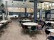 Large community room with numerous tables and chairs at 2620 Locksley St # 261, Sun City Center, FL 33573