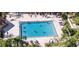 Aerial view of refreshing community pool with many swimmers at 2620 Locksley St # 261, Sun City Center, FL 33573