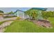 A light blue house with a paved driveway and landscaping at 2620 Locksley St # 261, Sun City Center, FL 33573