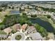 Aerial view of property highlighting its location within a golf course community at 804 Regal Manor Way, Sun City Center, FL 33573