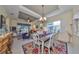 Bright dining room with a large table and colorful rug at 804 Regal Manor Way, Sun City Center, FL 33573
