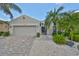 House exterior showcasing landscaping and a paved driveway at 804 Regal Manor Way, Sun City Center, FL 33573