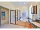 Spa-like bathroom with a soaking tub, double sinks, and a walk-in shower at 804 Regal Manor Way, Sun City Center, FL 33573