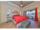 Spacious main bedroom with backyard access and a tranquil view at 804 Regal Manor Way, Sun City Center, FL 33573
