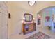 Bright entryway with a console table, mirror, and area rug at 804 Regal Manor Way, Sun City Center, FL 33573