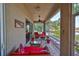Relaxing screened porch with comfy seating and lake view at 804 Regal Manor Way, Sun City Center, FL 33573