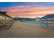 Enjoy a beautiful sunset while relaxing by the community pool at 804 Regal Manor Way, Sun City Center, FL 33573