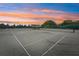 Community tennis courts at sunset, providing a beautiful view for players at 804 Regal Manor Way, Sun City Center, FL 33573