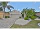 One-story home with a two-car garage and landscaped yard at 804 Regal Manor Way, Sun City Center, FL 33573