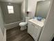 Updated bathroom with a new vanity, tub, and flooring at 3819 Queensboro S Ave, St Petersburg, FL 33711