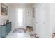 Bright and airy entryway with decorative console table and stylish rug at 8065 Rolling Shell Trl, Wesley Chapel, FL 33545