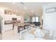 Open-concept kitchen with granite countertops and island seating at 8065 Rolling Shell Trl, Wesley Chapel, FL 33545