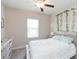 Bedroom with a ceiling fan and plant wall at 8065 Rolling Shell Trl, Wesley Chapel, FL 33545