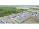 Aerial view of community near lake at 8065 Rolling Shell Trl, Wesley Chapel, FL 33545