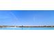 Large lagoon pool with a view of the surrounding area at 8065 Rolling Shell Trl, Wesley Chapel, FL 33545