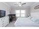 Spacious main bedroom with large bed and workspace at 8065 Rolling Shell Trl, Wesley Chapel, FL 33545