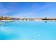 Expansive lagoon pool with clear blue water at 8065 Rolling Shell Trl, Wesley Chapel, FL 33545