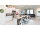 Modern kitchen with white cabinets, granite counters, and an island at 8065 Rolling Shell Trl, Wesley Chapel, FL 33545