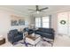 Comfortable living room featuring a cozy seating arrangement and large windows at 8065 Rolling Shell Trl, Wesley Chapel, FL 33545