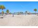 Beach volleyball court with stunning views of the community at 8065 Rolling Shell Trl, Wesley Chapel, FL 33545