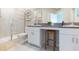 Double vanity bathroom with walk-in shower at 8065 Rolling Shell Trl, Wesley Chapel, FL 33545