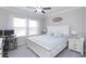 Main bedroom with king bed and workspace at 8065 Rolling Shell Trl, Wesley Chapel, FL 33545
