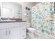 Bathroom with starfish shower curtain and granite countertop at 8065 Rolling Shell Trl, Wesley Chapel, FL 33545