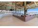 Tiki bar with thatched roof and bar seating at 8065 Rolling Shell Trl, Wesley Chapel, FL 33545