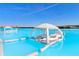 AquaBanas floating lounge with seating and shade at 8065 Rolling Shell Trl, Wesley Chapel, FL 33545