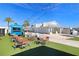 Resort-style pool with lounge chairs, umbrellas, and cabanas at 8065 Rolling Shell Trl, Wesley Chapel, FL 33545