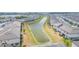 Aerial view of community with lake at 8065 Rolling Shell Trl, Wesley Chapel, FL 33545