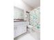 Bathroom with white cabinets and a seashell shower curtain at 8065 Rolling Shell Trl, Wesley Chapel, FL 33545