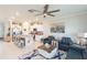 Open living space with stylish furniture and a view into the kitchen at 8065 Rolling Shell Trl, Wesley Chapel, FL 33545