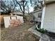 Backyard with storage shed and partially visible home at 6902 Rhode Island Dr, Tampa, FL 33619