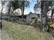 Home exterior with large trees and landscaping at 6902 Rhode Island Dr, Tampa, FL 33619