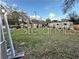 Overgrown vacant lot with distant structures at 6902 Rhode Island Dr, Tampa, FL 33619