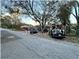 Home exterior with street view and trees at 6902 Rhode Island Dr, Tampa, FL 33619