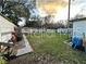 Backyard with grassy area and partial fence at 6902 Rhode Island Dr, Tampa, FL 33619