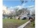 Spacious backyard with a shed and walkway at 6902 Rhode Island Dr, Tampa, FL 33619