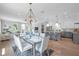 Bright dining room with modern table and chairs, adjacent to kitchen at 2345 Bahia Vista St, Sarasota, FL 34239