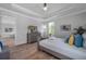 Serene bedroom with hardwood floors and dresser at 2345 Bahia Vista St, Sarasota, FL 34239