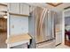 Stainless steel refrigerator in a kitchen with wood countertops at 31226 Saint Joe Rd, Dade City, FL 33525