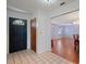 Home entryway with dark blue door and view into the dining area at 31226 Saint Joe Rd, Dade City, FL 33525