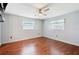 Bright bedroom with hardwood floors and ceiling fan at 31226 Saint Joe Rd, Dade City, FL 33525