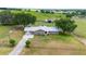 Aerial view of a ranch home on a spacious lot with farm views at 31226 Saint Joe Rd, Dade City, FL 33525