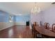 Dining room with hardwood floors, chandelier, and wood dining table at 31226 Saint Joe Rd, Dade City, FL 33525