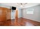 Spacious bedroom with hardwood floors and ceiling fan at 31226 Saint Joe Rd, Dade City, FL 33525