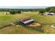Rustic barn with metal roof in a fenced area at 31226 Saint Joe Rd, Dade City, FL 33525