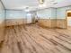 Large bonus room with light walls and wood floors at 31226 Saint Joe Rd, Dade City, FL 33525